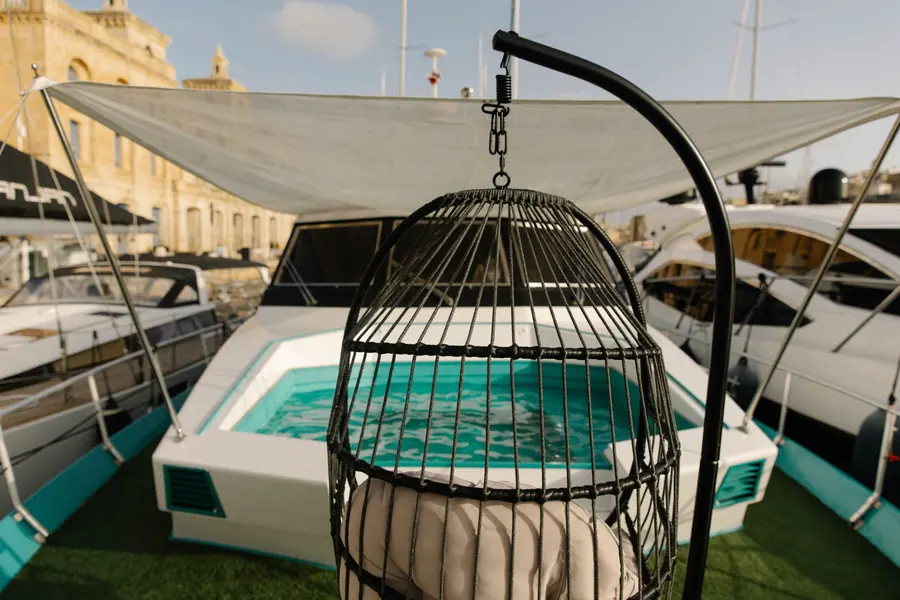 Hanging egg chair in front of the plunge pool on the bow
