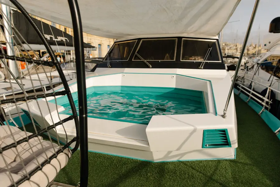 Private plunge pool on the bow of the yacht under a sun sail