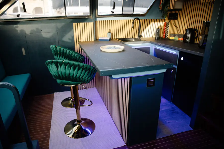 Kitchen island with bar stools and LED lighting