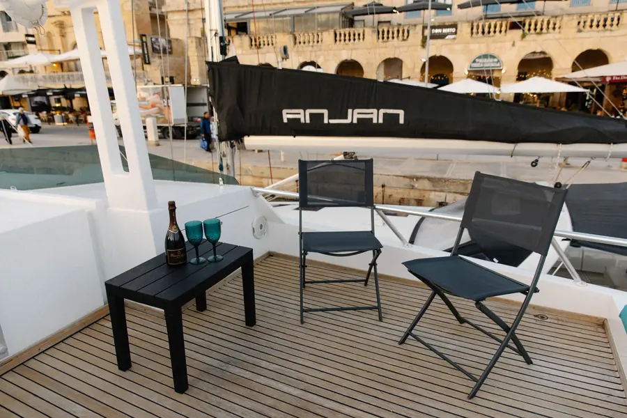 Flybridge table and chairs overlooking the Birgu waterfront