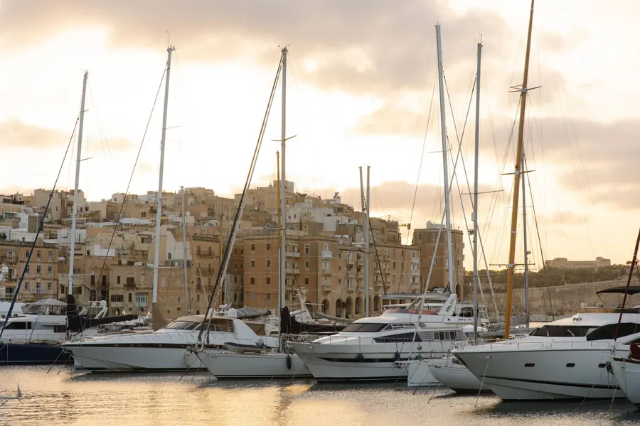 Yachts in Grand Harbour Marina with Senglea behind at sunset